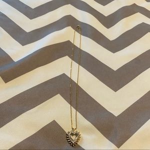 Woman’s 14kt gold chain and diamond heart pendant